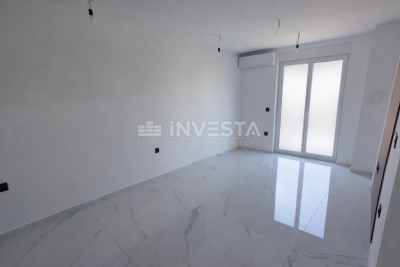 Jednosoban stan s vrtom u novogradnji s uporabnom